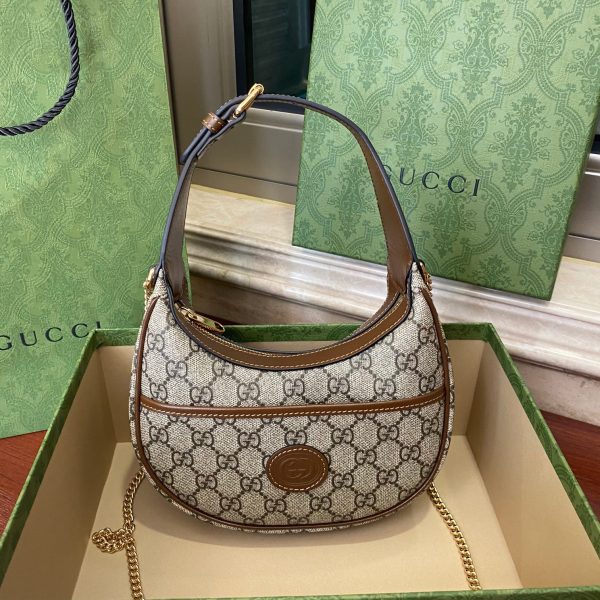 Oval leather half-moon mini handbag