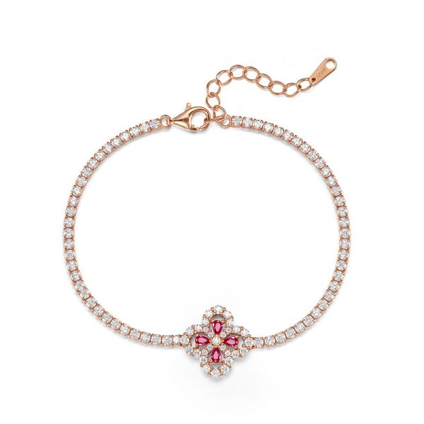 Four-leaf clover grown into red gemstone bracelet