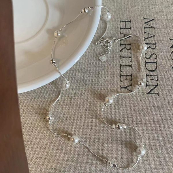 Design a snake-shaped pearl necklace